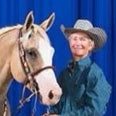 Candace Pratt standing next to her horse